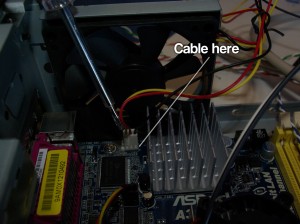 The cable for the CPU fan being plugged in.